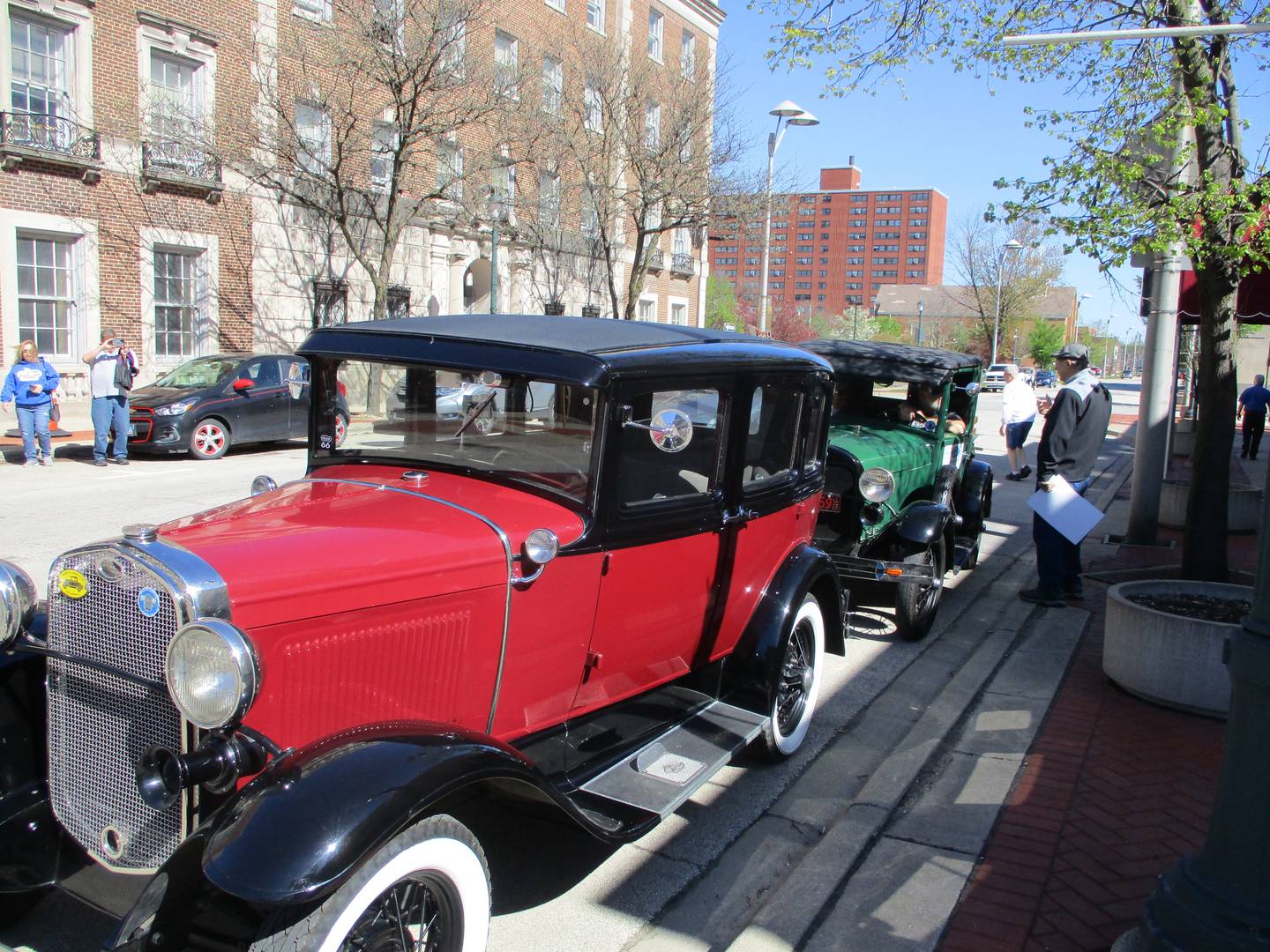 Two Model A Fords are parked outside the Joliet Area Historical Museum as their owners start on the Route 66 Red Carpet Corridor Festival on Saturday, May 7, 2022.