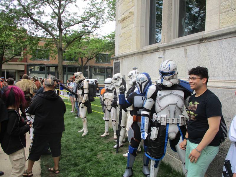 Landon Garcia of Schererville, Indiana poses for a photo with costumers at Star Wars Day in Joliet on Saturday, June 4, 2022.