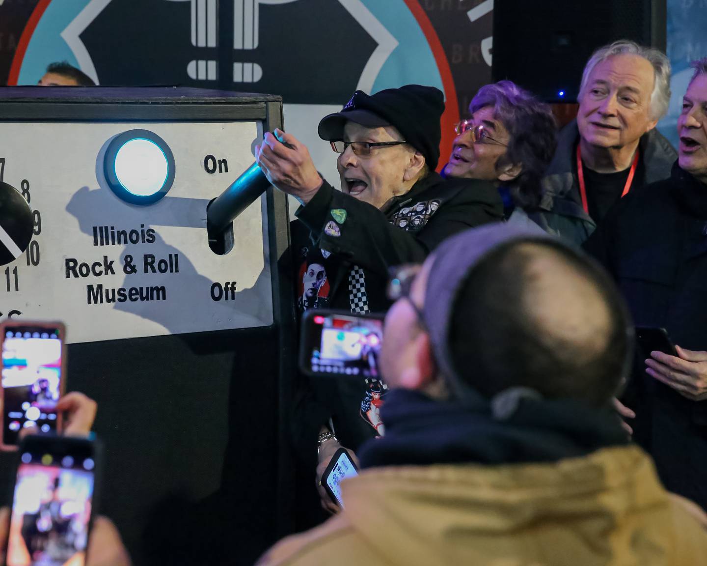 Rick Nielsen of Cheap Trick lights GIGANTAR during the celebratory lighting ceremony at the Illinois Rock and Roll museum.  Jan 20, 2023.